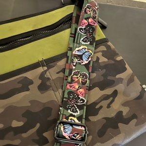 Crossbody bag, camo on one side, army green on back. Thick strap w butterflies.